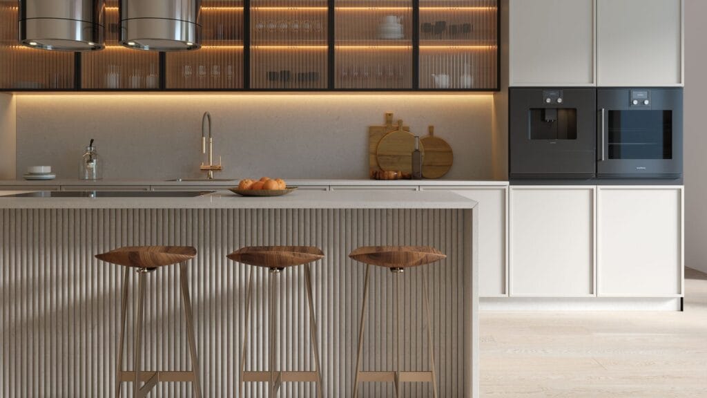 Minimalistic modern kitchen with reeded glass cabinets, fluted kickboard, Caesarstone Mineral Oyster surfaces, stainless steel rangehood and ovens.