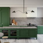Modern kitchen featuring deep green cabinetry, a Caesarstone benchtop and splashback with natural veining, sculptural black pendant light for a bold yet elegant design