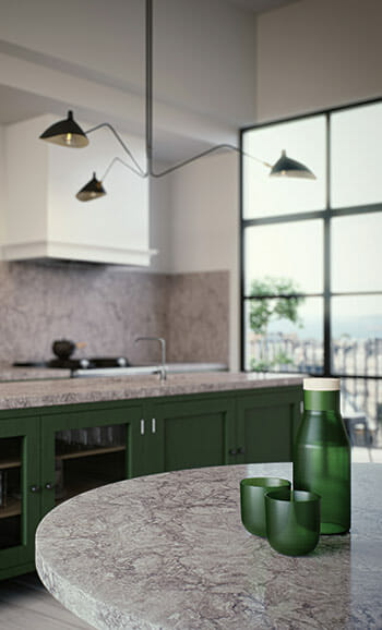 Modern kitchen featuring deep green cabinetry, a Caesarstone benchtop and splashback with natural veining, sculptural black pendant light for a bold yet elegant design