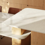 Modern kitchen island benchtop flowing into dining room table, using Caesarstone mineral surfaces.