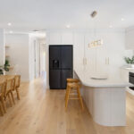 Caesarstone 2141 Snow surface in modern white kitchen with island