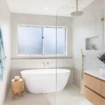Caesarstone 2141 Snow surface in modern white bathroom