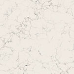 White marble surface with subtle gray veining in an irregular pattern.