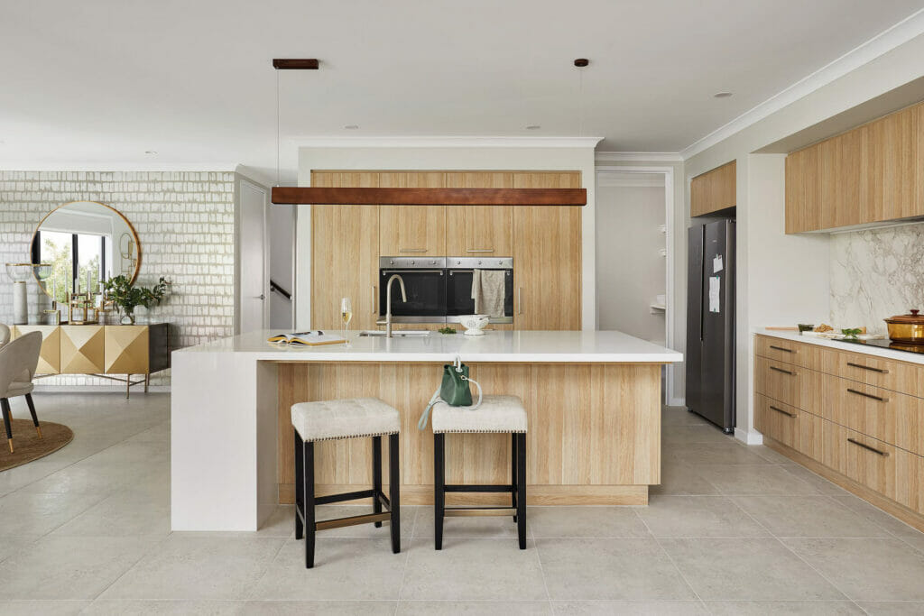 modern kitchen with wooden features, concrete floors, and Caesarstone Snow benchtop.