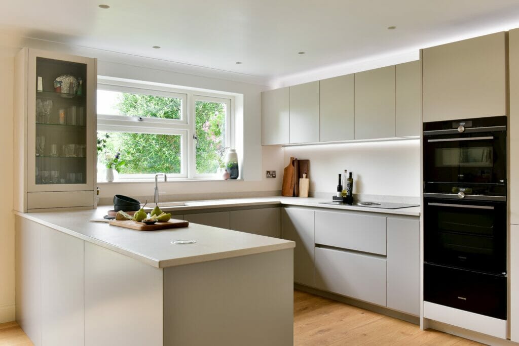 concrete themed peninsular kitchen