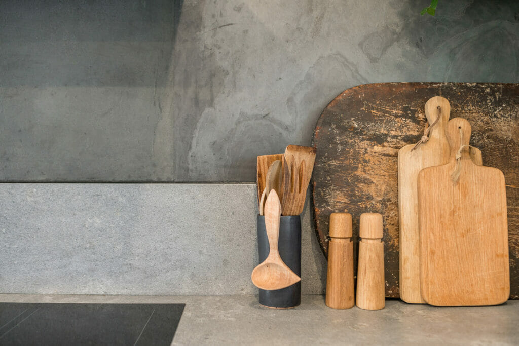 Wooden chopping boards and kitchen utensils.