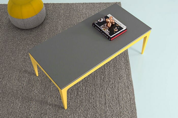 Yellow Urbi furniture with grey caesarstone countertop.