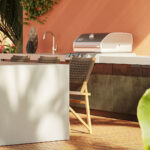 Sunlit alfresco kitchen featuring durable, UV-resistant Caesarstone porcelain benchtop and table.