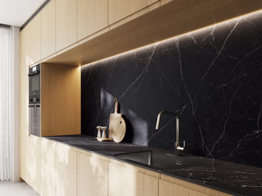 Black splashback and benchtop in a modern kitchen.