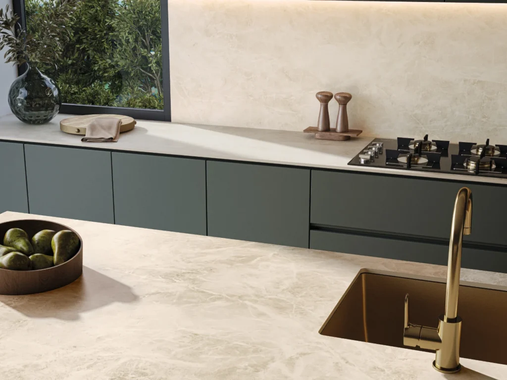 Minimalist kitchen with white splashback and benchtops, and navy blue cabinetry
