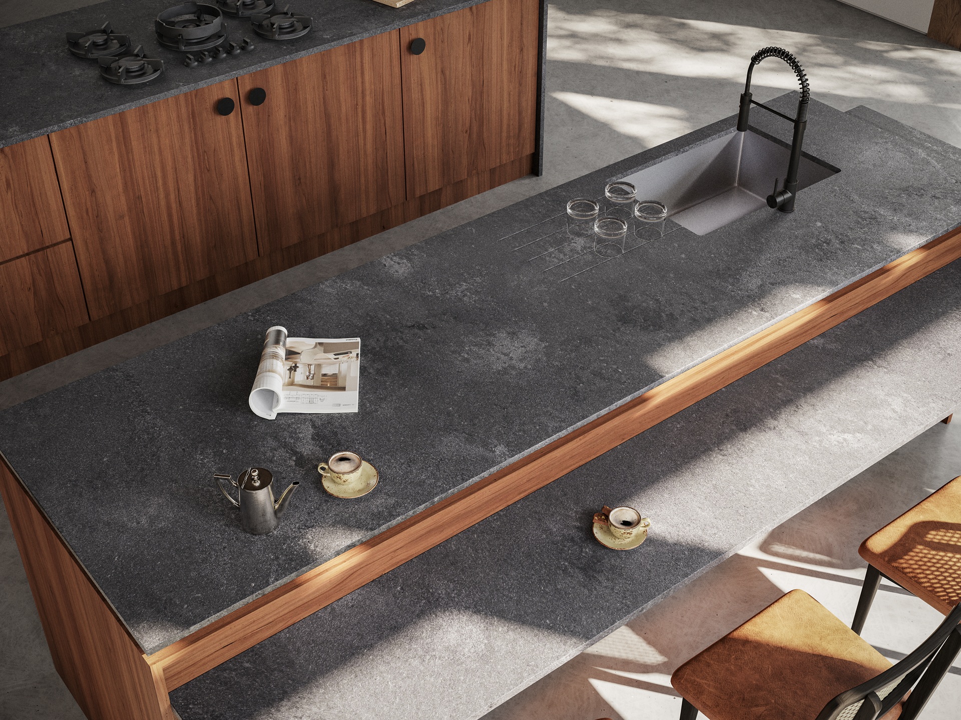 Dark grey benchtop in a moody modern kitchen with timber panelling