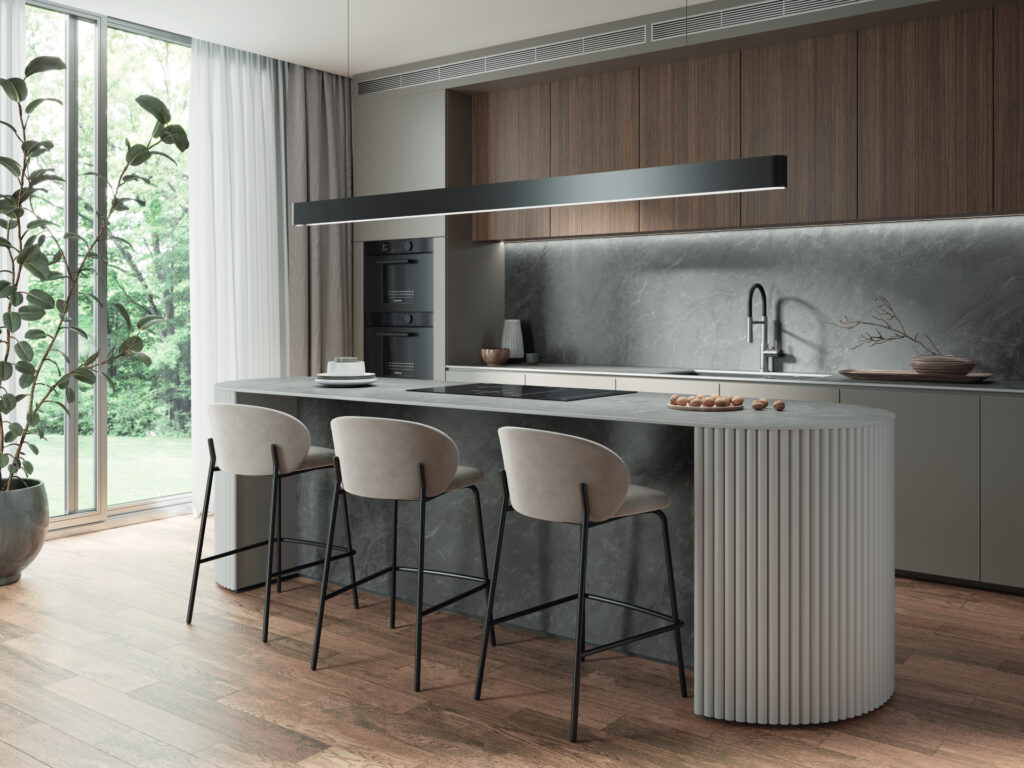 Modern kitchen with curved Caesarstone Silverdrop Porcelain benchtop, reeded timber edges.