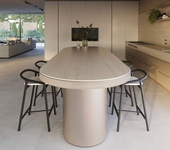 Curved dining room table with Caesarstone Silvax Porcelain surface, thick round table base with dark dining chairs.