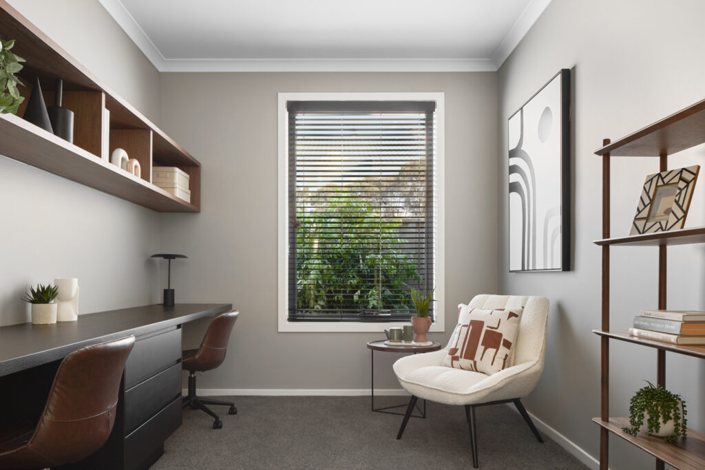 Modern home office featuring a sleek Caesarstone desktop in a dark mineral surface, offering a durable and refined foundation for productive, stylish workdays.