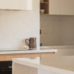Caesarstone 5144 Rossa Nova in modern white kitchen - AU project