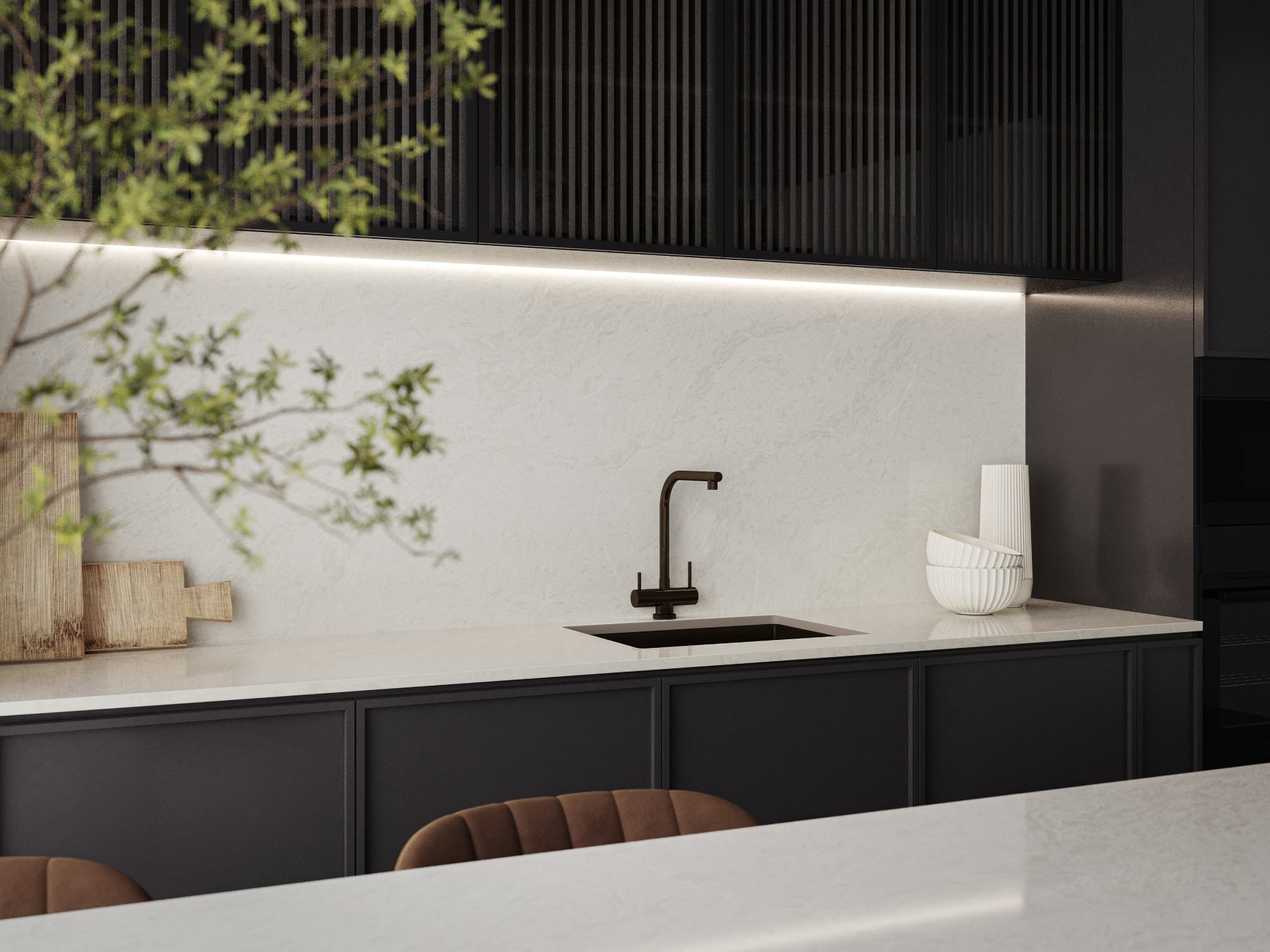 Kitchenette featuring Caesarstone countertops, fluted timber cabinetry, and a light-reflective minimalist palette.