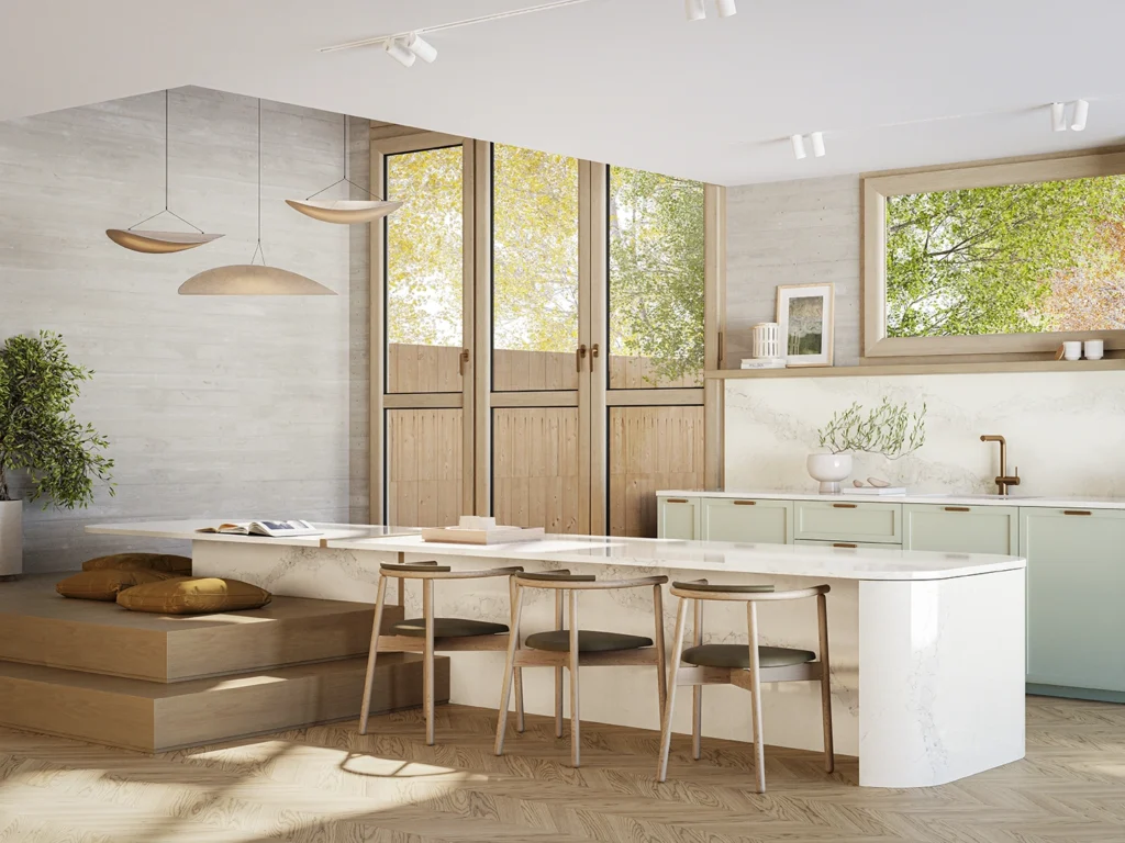 Light-filled modern kitchen with curved white Caesarstone benchtop, built-in timber seating, mint green cabinetry, and large windows framing autumn foliage.
