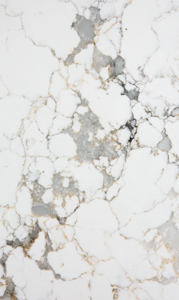 Close-up of Caesarstone<sup>®</sup> ICON™ Calacatta Dreamwave showcasing intricate veining and layered mineral texture.