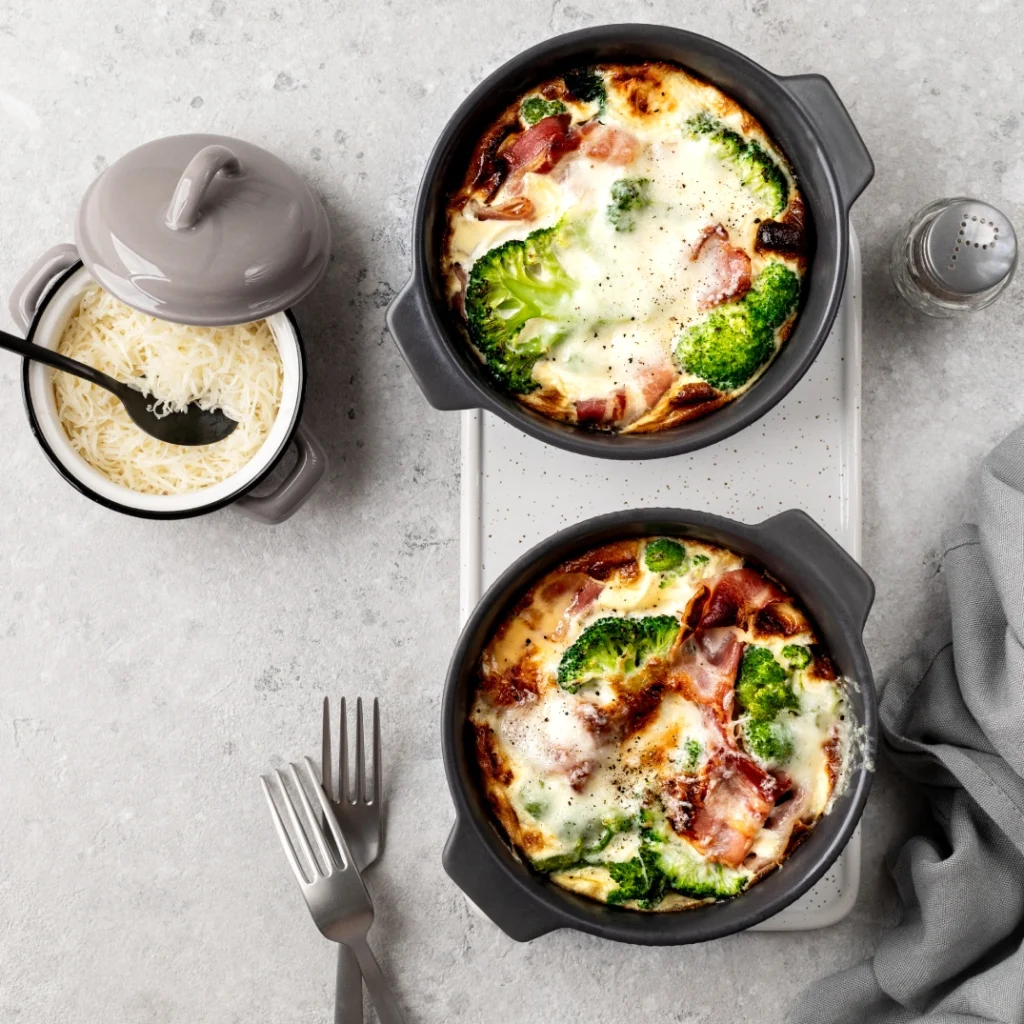 Hot dishes resting on a Caesarstone benchtop with trivets and utensils, demonstrating safe surface protection during cooking.