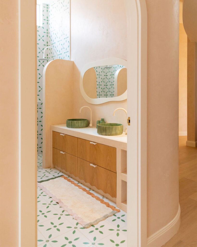 Porcelain bathroom vanity with green ceramic basin and mosaic tiled splashback