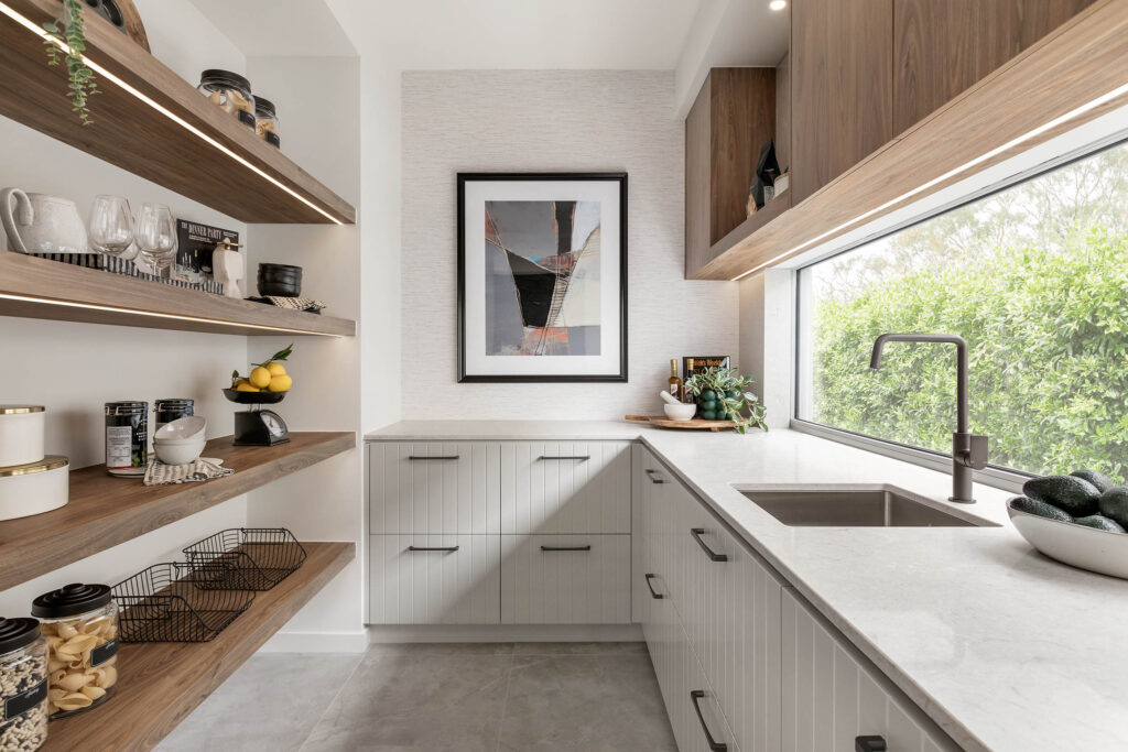 Butlers pantry with Bianco Drift Caesarstone<sup>®</sup> benchtop and warm timber cabinetry