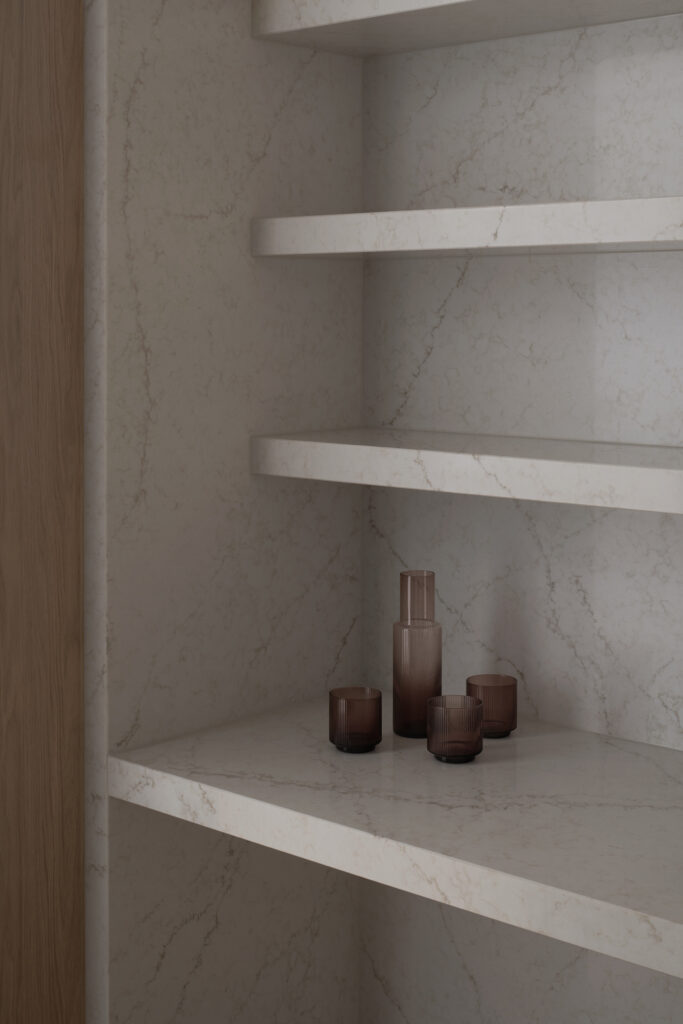 Butler’s pantry detail inside Caesarstone’s Adelaide flagship showroom featuring ICON™ Rossa Nova Advanced Mineral surface with integrated shelving.