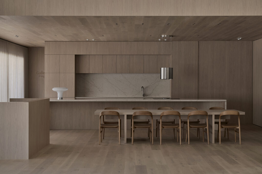 Sculptural island bench featuring Caesarstone<sup>®</sup> ICON™ Rossa Nova Advanced Mineral surface with Polytec cabinetry inside the Wingfield flagship showroom in Adelaide.