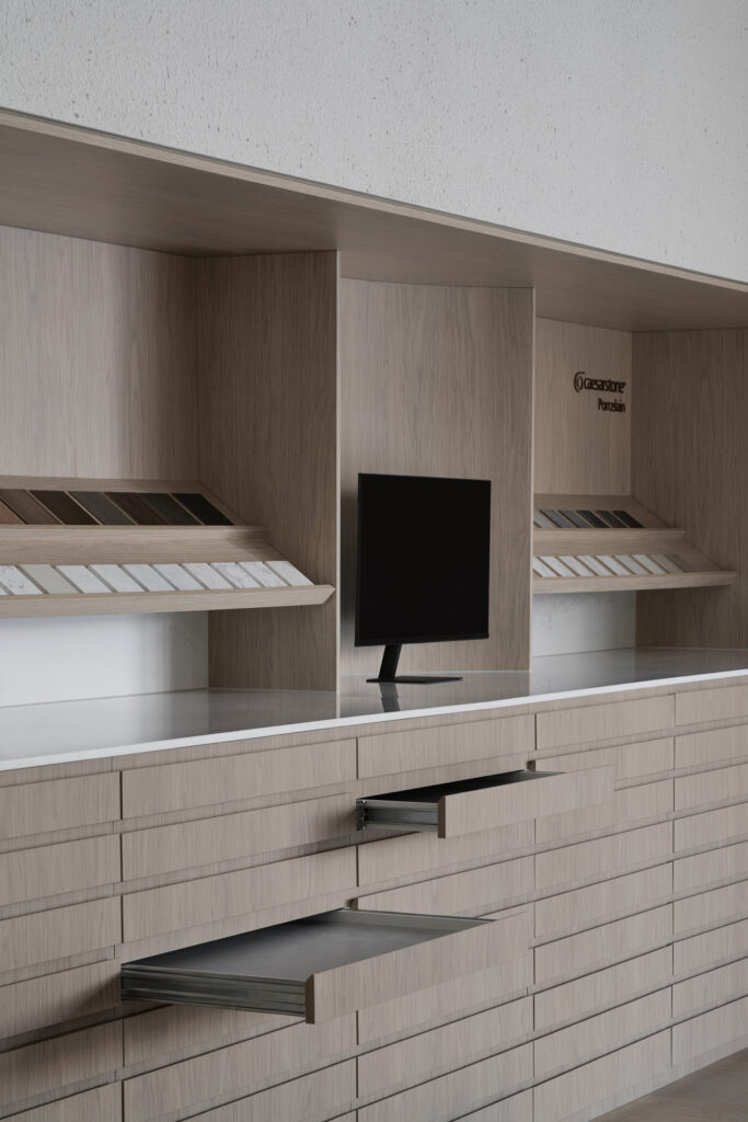 Interactive slab drawer system and digital design screen inside Caesarstone’s Wingfield showroom in Adelaide showcasing Caesarstone<sup>®</sup> ICON™ Advanced Mineral and Porcelain surfaces.