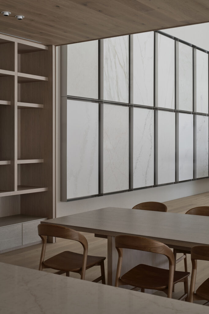 Large-format surface slab gallery and meeting table inside Caesarstone’s Wingfield flagship showroom in Adelaide.