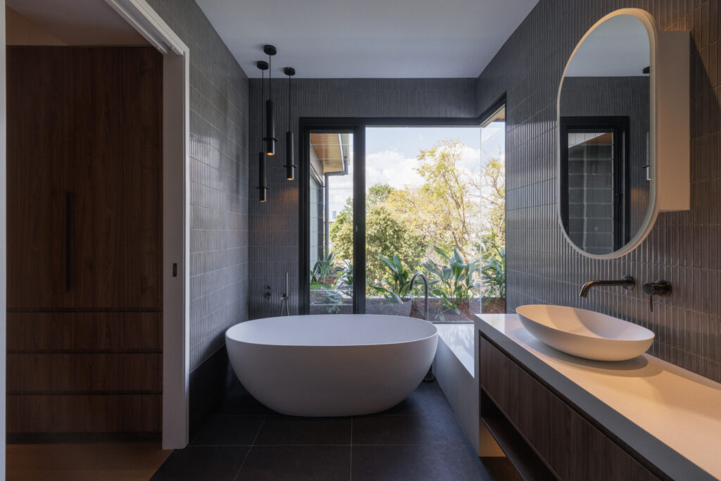 Bathroom vanity with Caesarstone Intense White™ mineral benchtop, concrete walls and timber cabinetry