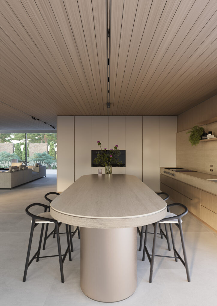 Contemporary kitchen with elongated dining island in Caesarstone<sup>®</sup> 550 Silvax porcelain featuring layered travertine-inspired detailing and warm neutral interiors.