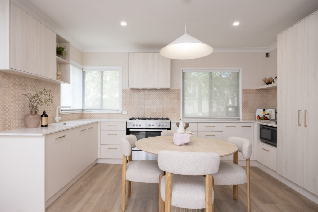Carina Heights kitchen with Caesarstone<sup>®</sup> ICON™ Frosty Carrina surface and oak accents