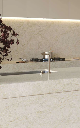 Caesarstone<sup>®</sup> Taj Whisper™ 8251 ICON Mineral benchtop and full-height splashback with gas cooktop and dark foliage styling