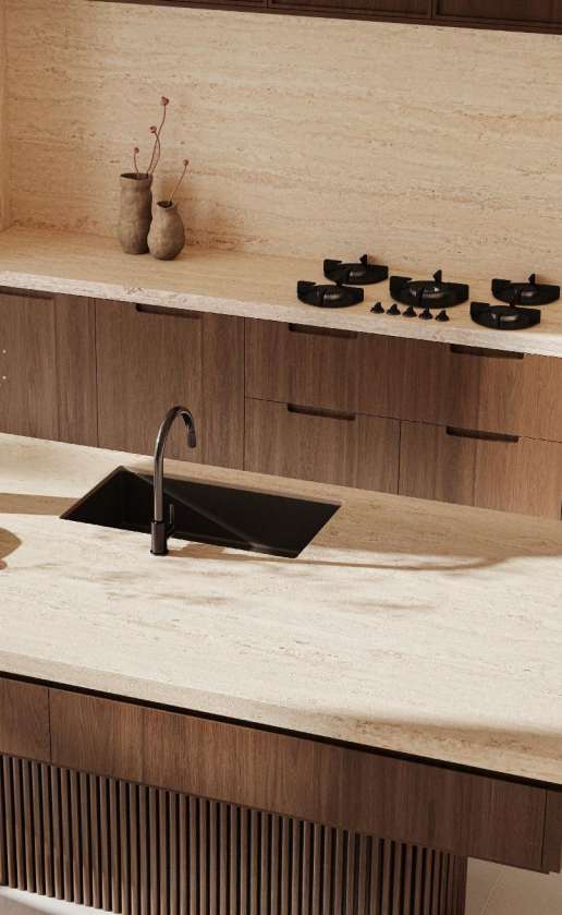 Caesarstone<sup>®</sup> Travina™ 551 porcelain benchtop and splashback with horizontal travertine banding in contemporary kitchen with dark timber cabinetry and black sink