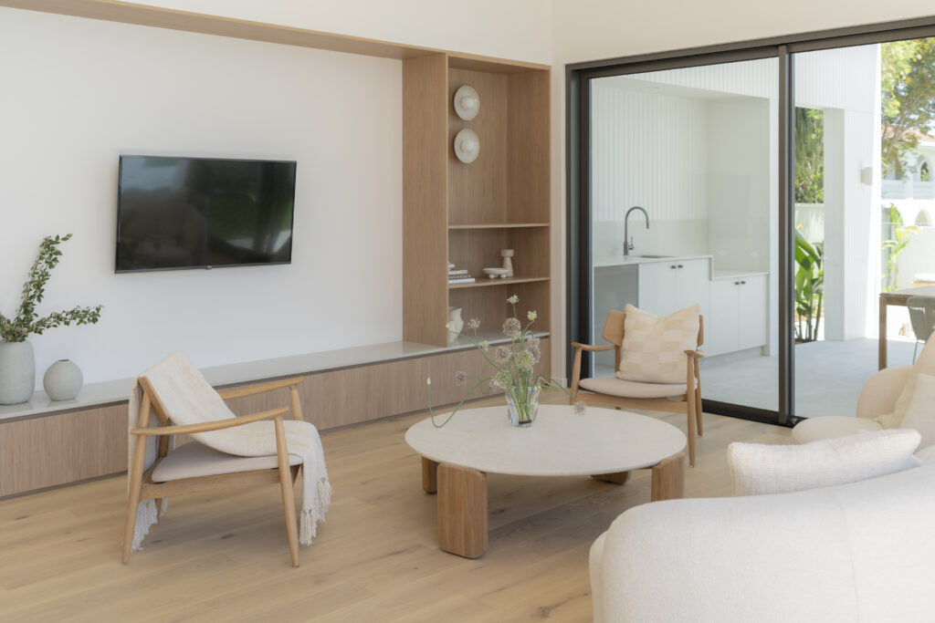 Built-in TV unit with Brillianza™ surface, timber joinery and integrated shelving