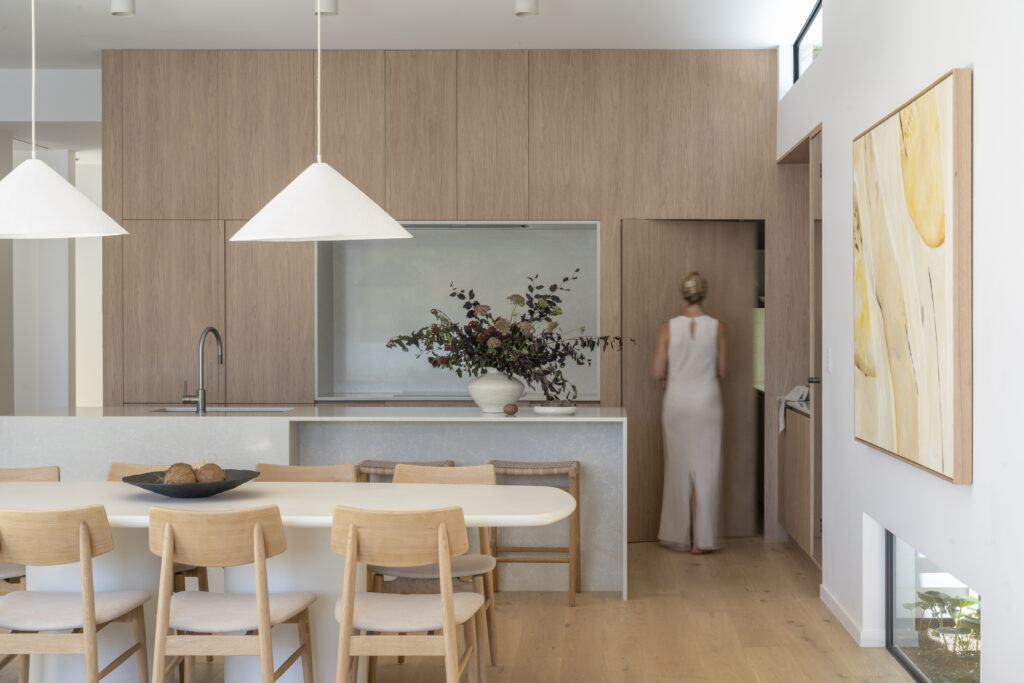 Open-plan kitchen with Brillianza™ benchtop, timber joinery and natural light
