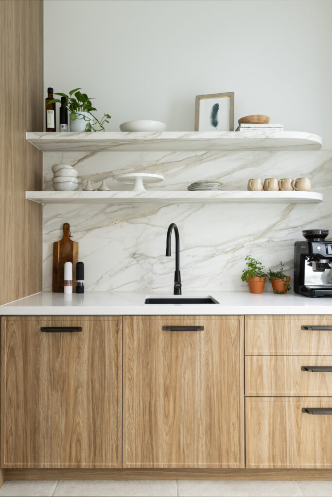 Butler’s pantry with full-height Mirabel™ porcelain splashback, open shelving, timber cabinetry and matte black tapware