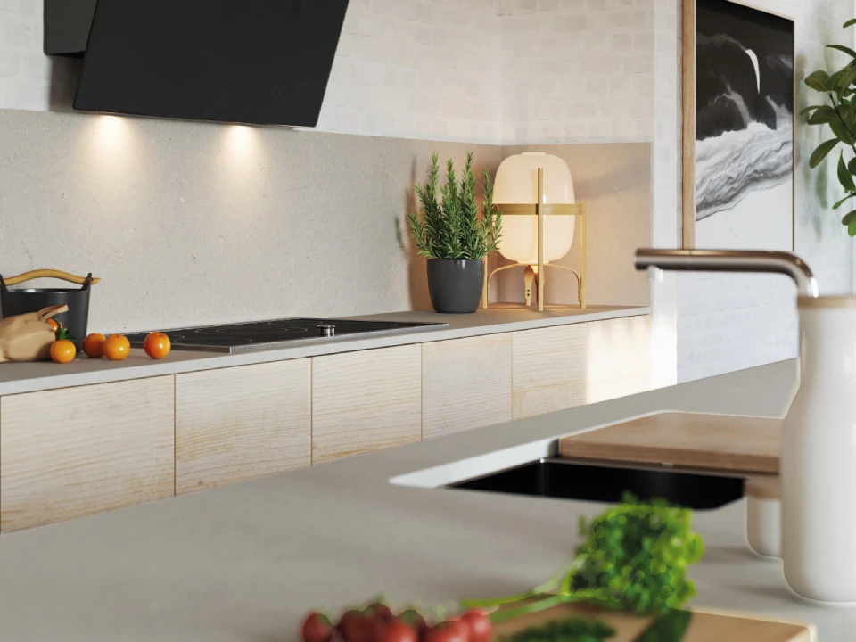 Warm minimalist kitchen in a Japandi-inspired scheme, featuring a Caesarstone<sup>®</sup> Raw Concrete benchtop and splashback with timber-look cabinetry and black rangehood.