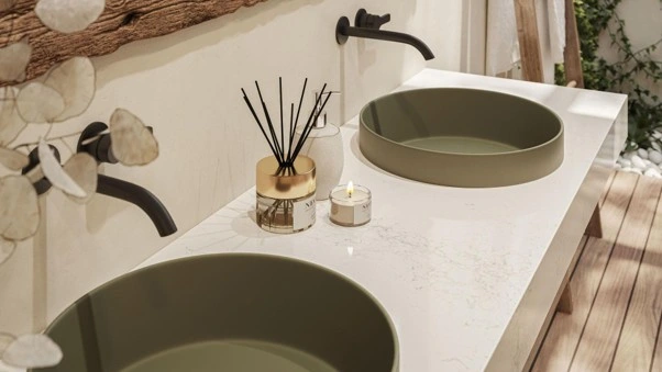 Full Caesarstone<sup>®</sup> slab in solenna as a bathroom vanity green sinks